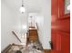Foyer with hardwood stairs and decorative tiled flooring at 4935 W Carriage Dr, New Palestine, IN 46163