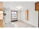 Bright laundry room with a utility sink, window, and convenient storage solutions at 4935 W Carriage Dr, New Palestine, IN 46163