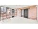 Spacious sunroom with a bench, multiple windows, and access to the outside, providing a bright and airy space at 4935 W Carriage Dr, New Palestine, IN 46163