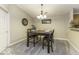 Dining area featuring carpet, a dark wood table set, and stylish lighting fixture at 5003 Amber Creek Pl # 309, Indianapolis, IN 46237