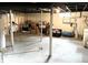 View of the unfinished basement with concrete floors, cinder block walls and visible utilities at 5368 Southeastern Ave, Indianapolis, IN 46203