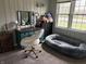 Stylish bedroom with a vanity and comfortable pet bed at 5368 Southeastern Ave, Indianapolis, IN 46203
