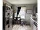 Cozy kitchen with stainless steel refrigerator and eat-in dining area at 5368 Southeastern Ave, Indianapolis, IN 46203