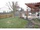 This spacious back yard has a patio, plenty of room to play, and a privacy fence at 5437 Powder River Ct, Indianapolis, IN 46221