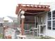 A delightful backyard patio with a pergola-covered seating area, perfect for outdoor entertaining at 5437 Powder River Ct, Indianapolis, IN 46221