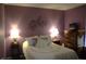 The bedroom features purple walls with tasteful decor and a comfortable bed at 5437 Powder River Ct, Indianapolis, IN 46221