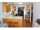 Efficient kitchen featuring wood cabinetry, white countertops and an open layout to the living space at 5437 Powder River Ct, Indianapolis, IN 46221