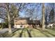 Charming two-story home with a well-maintained lawn and inviting front porch, perfect for enjoying the outdoors at 5819 Bar Del E Dr, Indianapolis, IN 46221