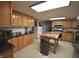 Spacious kitchen with stainless steel appliances, a large island and butcher block countertop at 5819 Bar Del E Dr, Indianapolis, IN 46221
