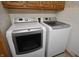 Bright laundry room equipped with modern Maytag washer and dryer for convenient laundry care at 5819 Bar Del E Dr, Indianapolis, IN 46221
