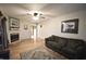 Comfortable living room featuring hardwood floors, a fireplace, and ample seating at 5819 Bar Del E Dr, Indianapolis, IN 46221
