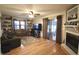 Comfortable living room featuring built-in shelves, a fireplace, and sliding doors to the outside at 5819 Bar Del E Dr, Indianapolis, IN 46221