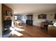 Inviting living area featuring gleaming hardwood floors, a cozy fireplace, and ample natural light at 5819 Bar Del E Dr, Indianapolis, IN 46221