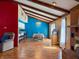 Open concept dining room features hardwood floors and bright blue accent wall at 619 Heritage Ln, Anderson, IN 46013