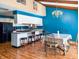 Bright kitchen open to dining area with white cabinets and black appliances at 619 Heritage Ln, Anderson, IN 46013