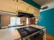 Well-equipped kitchen featuring a gas cooktop, bright counters, and eat-in dining area with ample natural light at 619 Heritage Ln, Anderson, IN 46013