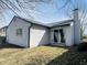 Exterior side view of home showcasing a sliding door and a backyard at 6640 Manassas Dr, Indianapolis, IN 46241