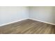 Bedroom featuring neutral walls and wood-look flooring at 6640 Manassas Dr, Indianapolis, IN 46241