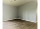Neutral bedroom featuring laminate flooring and ample natural light at 6640 Manassas Dr, Indianapolis, IN 46241