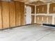 View of the garage featuring unfinished drywall and a concrete floor at 6640 Manassas Dr, Indianapolis, IN 46241