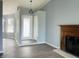 Bright living room with stylish laminate flooring and classic fireplace at 6640 Manassas Dr, Indianapolis, IN 46241