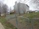 Fenced backyard with gentle slope at 728 Woodway Ln, Bargersville, IN 46106