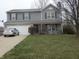 Charming two-story home with attached garage and landscaped yard at 728 Woodway Ln, Bargersville, IN 46106