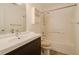 Bathroom featuring a vanity with dark wood cabinets and an enclosed white tile shower and tub at 7352 Crickwood Pl, Indianapolis, IN 46268