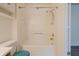 Clean bathroom with white tile tub and shower combo with a built in shelf at 7352 Crickwood Pl, Indianapolis, IN 46268