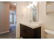Bathroom featuring a vanity with dark wood cabinets and an extra lighting to improve visibility at 7352 Crickwood Pl, Indianapolis, IN 46268