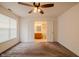 Bedroom featuring a ceiling fan, closet leading to the bathroom and a window with natural light at 7352 Crickwood Pl, Indianapolis, IN 46268