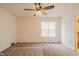 Bright bedroom with ceiling fan, closet access and natural light from a window at 7352 Crickwood Pl, Indianapolis, IN 46268