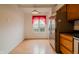 Kitchen space featuring stainless steel refrigerator and appliances with bright sunlight streaming through the window at 7352 Crickwood Pl, Indianapolis, IN 46268
