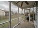 A screen enclosed patio with a ceiling fan at 7352 Crickwood Pl, Indianapolis, IN 46268