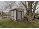 Outdoor storage shed in backyard is surrounded by large trees at 7352 Crickwood Pl, Indianapolis, IN 46268