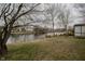 Lush backyard with gorgeous water views, trees and abundant greenery, perfect for relaxation at 7352 Crickwood Pl, Indianapolis, IN 46268