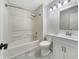 Bathroom with a shower-tub combo, toilet, vanity, and a sink at 7850 Park North Bnd, Indianapolis, IN 46260