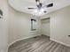 Bedroom with ceiling fan, closet, and durable flooring at 7850 Park North Bnd, Indianapolis, IN 46260