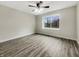 Spacious bedroom featuring durable flooring, a ceiling fan, and natural light at 7850 Park North Bnd, Indianapolis, IN 46260