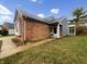 Charming brick home with attached sunroom and beautiful vinyl siding accents at 7850 Park North Bnd, Indianapolis, IN 46260