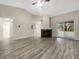 Spacious living room featuring hardwood floors, a fireplace, and sliding glass doors to the patio at 7850 Park North Bnd, Indianapolis, IN 46260