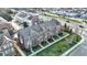 Aerial view of townhomes displaying gardens, sidewalks, and landscaping within the community at 8613 N Meridian St, Indianapolis, IN 46260
