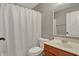 Bright bathroom featuring a single sink vanity and white shower curtain at 8613 N Meridian St, Indianapolis, IN 46260