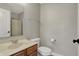 Functional bathroom featuring neutral walls, a vanity, a toilet, and a shower stall at 8613 N Meridian St, Indianapolis, IN 46260