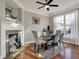 Elegant dining area with a fireplace, glass-top table, and ample natural light at 8613 N Meridian St, Indianapolis, IN 46260