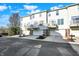 Row of three-story townhomes with attached garages and personal balconies, perfect for urban living at 8613 N Meridian St, Indianapolis, IN 46260