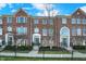 Charming brick townhomes featuring manicured landscaping and a classic, welcoming exterior at 8613 N Meridian St, Indianapolis, IN 46260