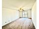 Spacious bedroom features a sliding glass door and ceiling fan at 934 Sorrell Ct, Lebanon, IN 46052