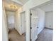 Hallway with carpet and white doors leading to bedrooms and other areas of the house at 934 Sorrell Ct, Lebanon, IN 46052