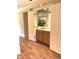 Entertain in this wet bar area featuring decorative mirror tiles and wooden cabinets at 1054 Carters Grove, Indianapolis, IN 46260